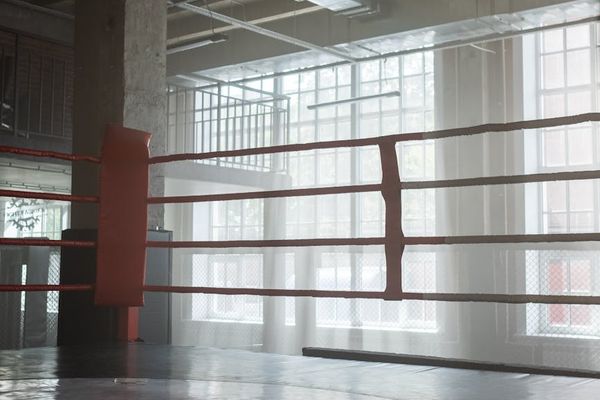 Clean and spacious training hall with modern equipment and natural light.